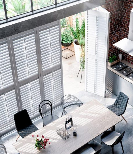 kitchen with large table and full height shutters in Worthing