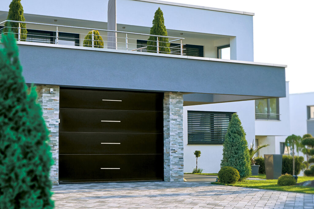 A black and white sectional garage door from SWS UK