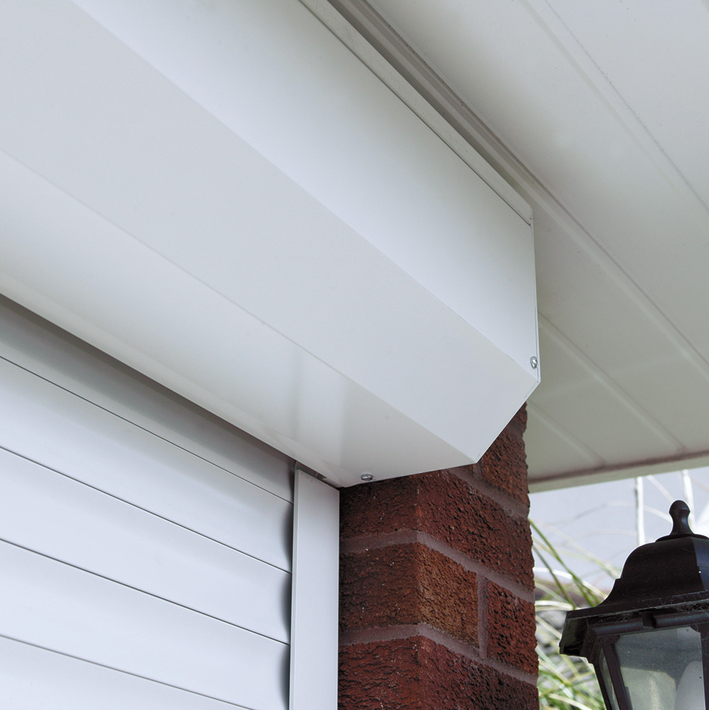 Close up of a white unit that stores roller garage doors