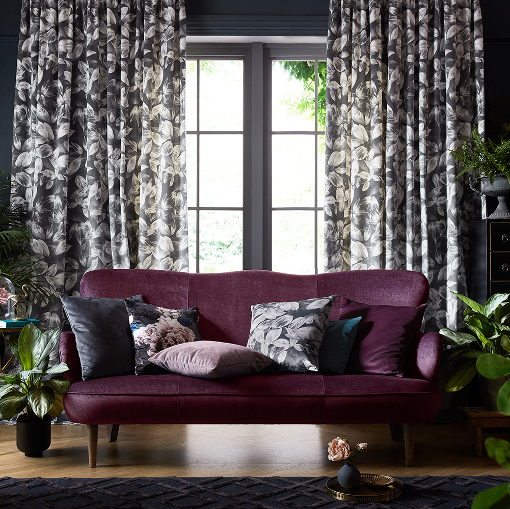 Patterned floral curtains framing a living room window in Worthing