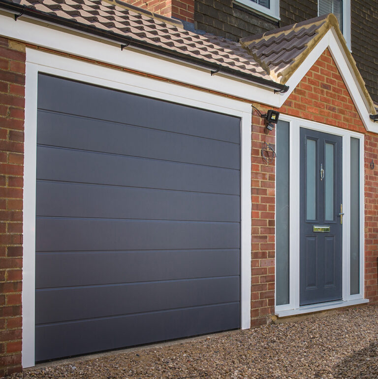 Sectional garage doors in Horsham fitted to a modern brick property